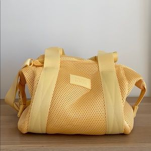 Dagne Dover yellow mesh duffle bag